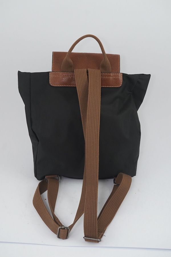 A Longchamps black rucksack, a shoulder bag and a briefcase bag